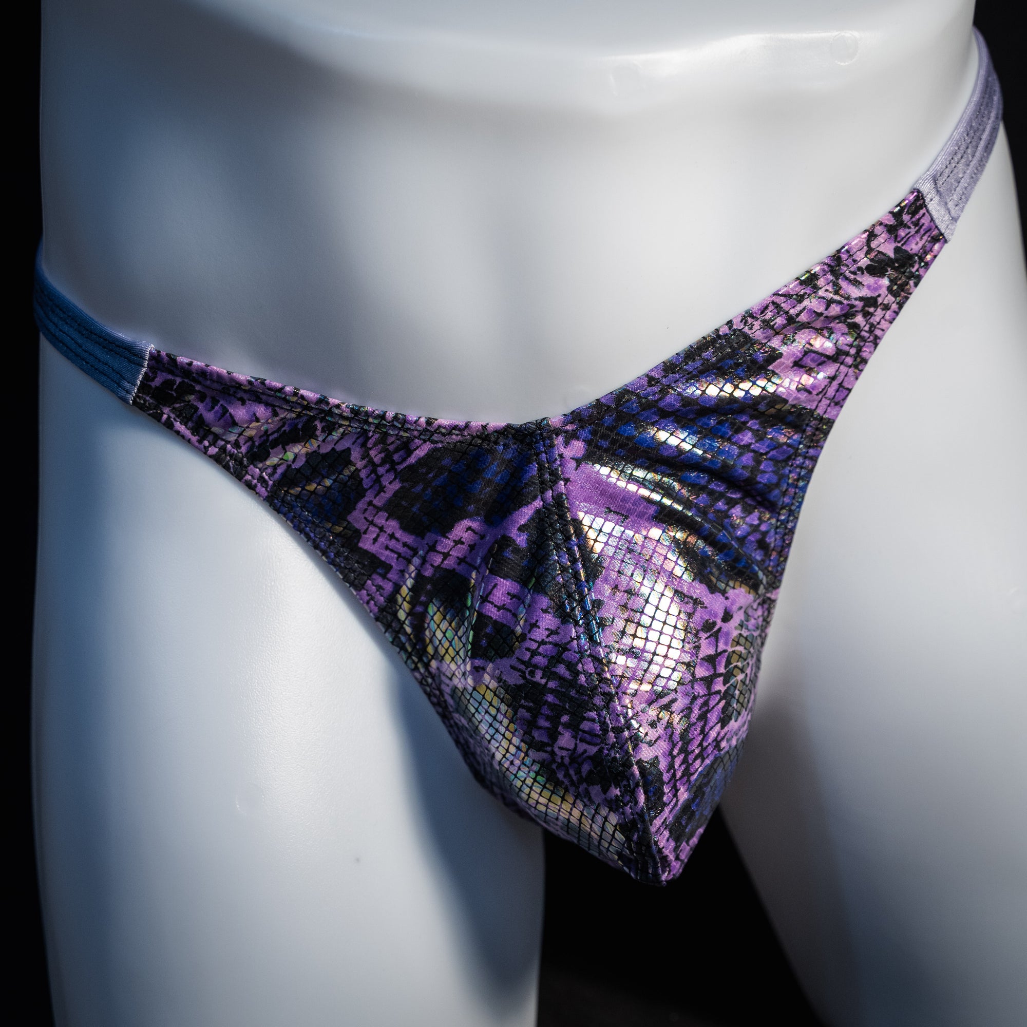 Men's purple metallic snakeskin thong underwear, classic cut, front view.