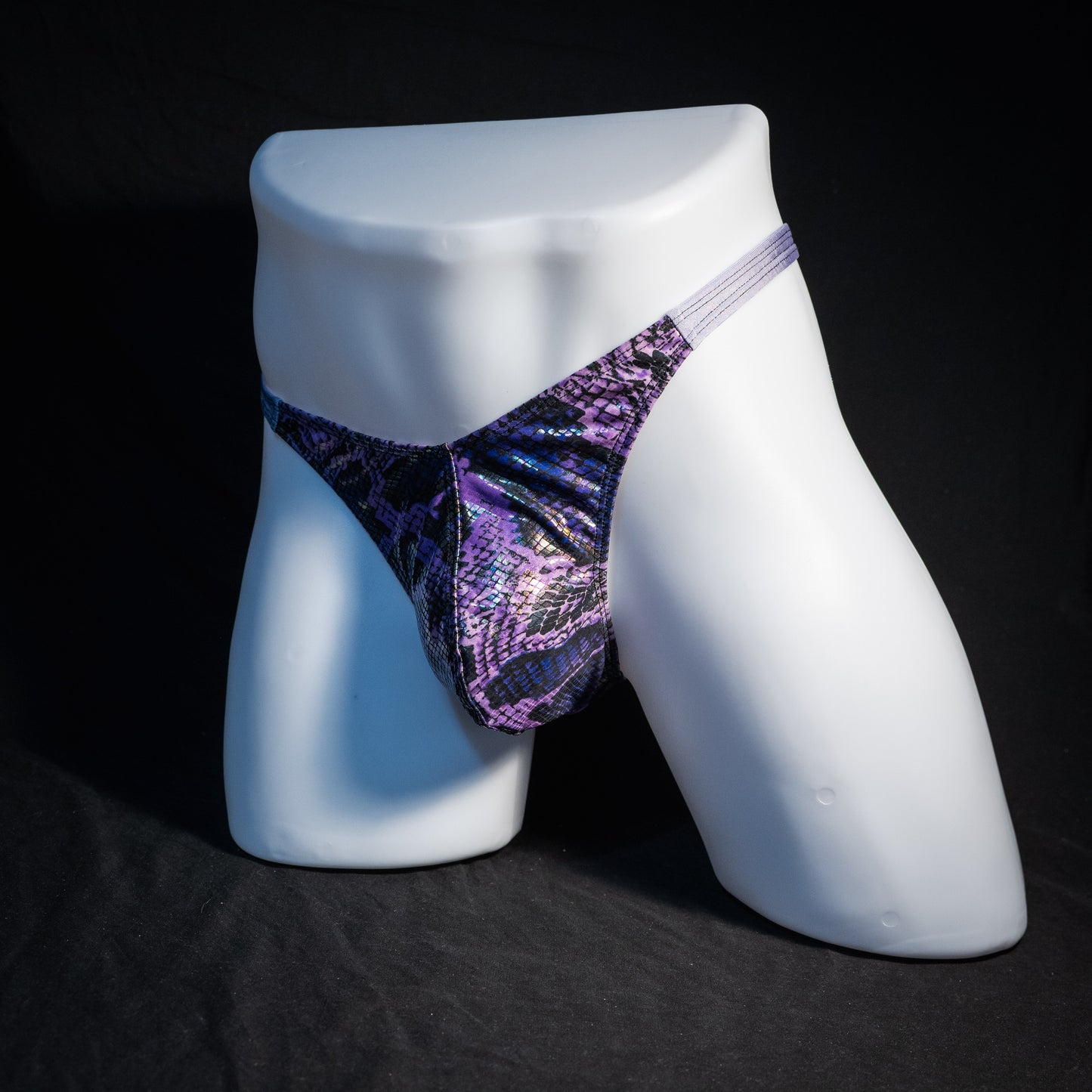 Men's purple metallic snakeskin thong underwear, classic cut, front view.