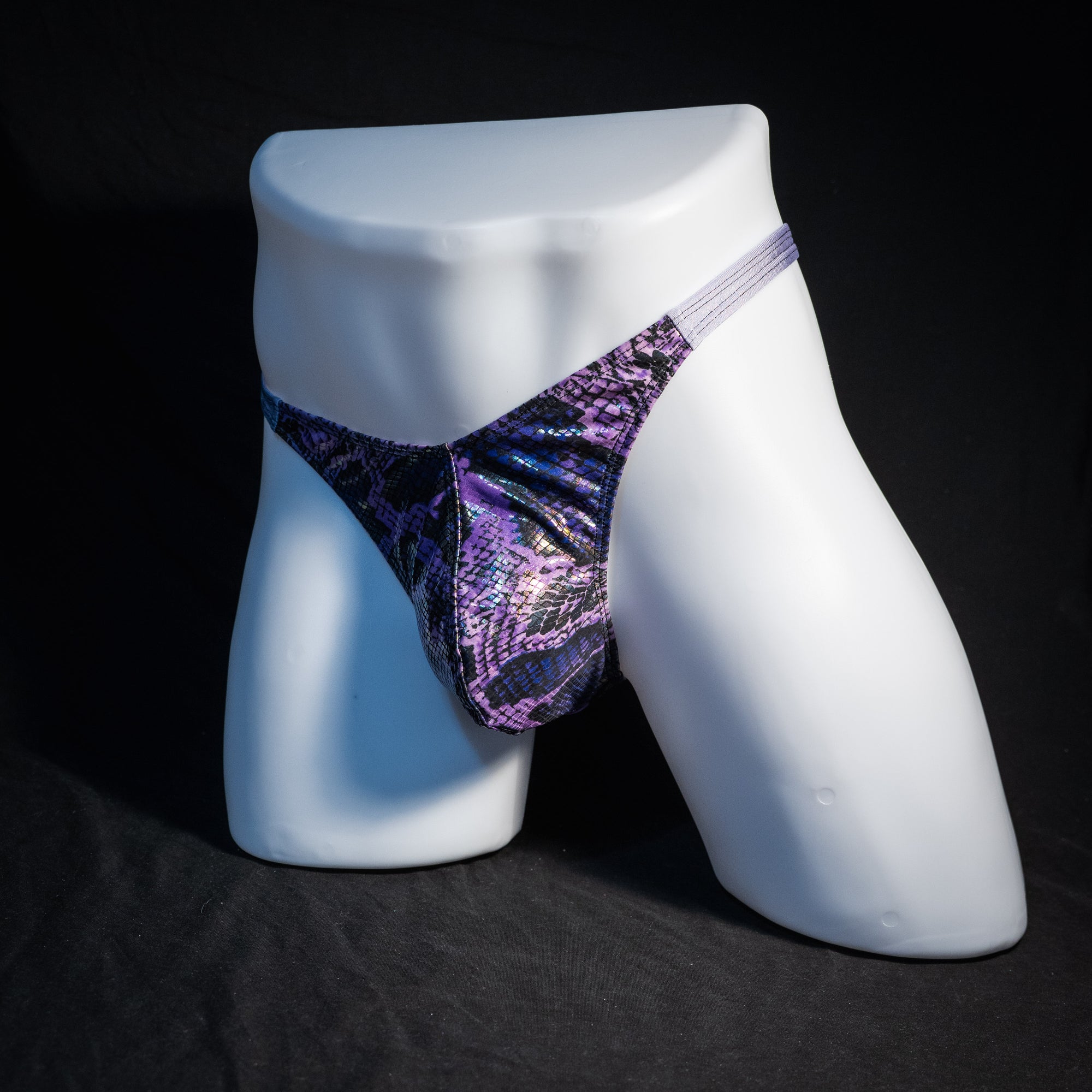 Men's purple metallic snakeskin thong underwear, classic cut, front view.