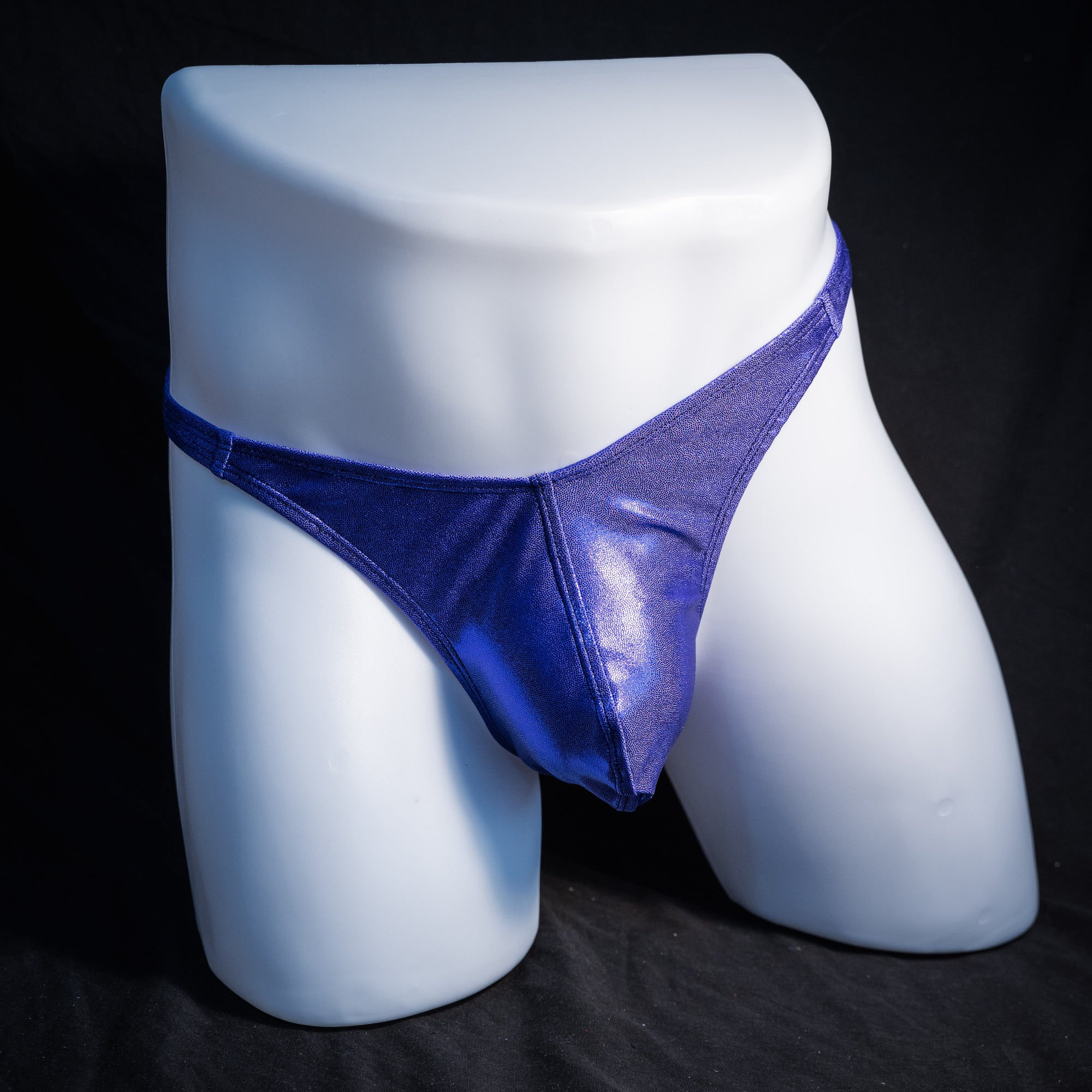 Men's purple metallic thong underwear, classic cut, front view.