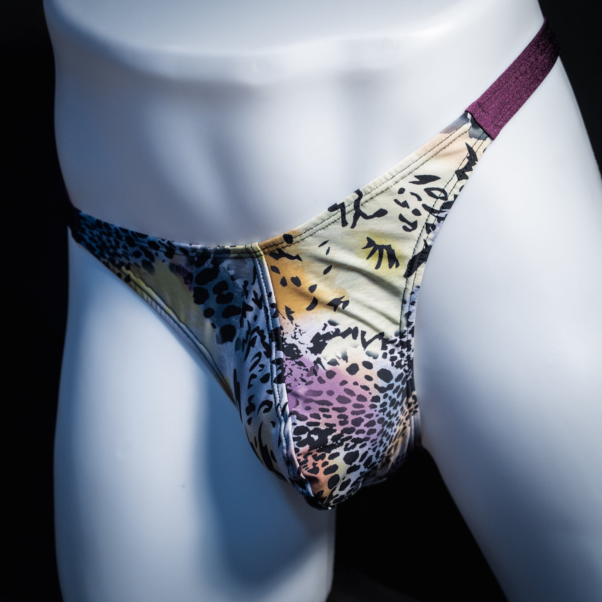 Men's purple wild cat thong underwear, classic cut, front view.