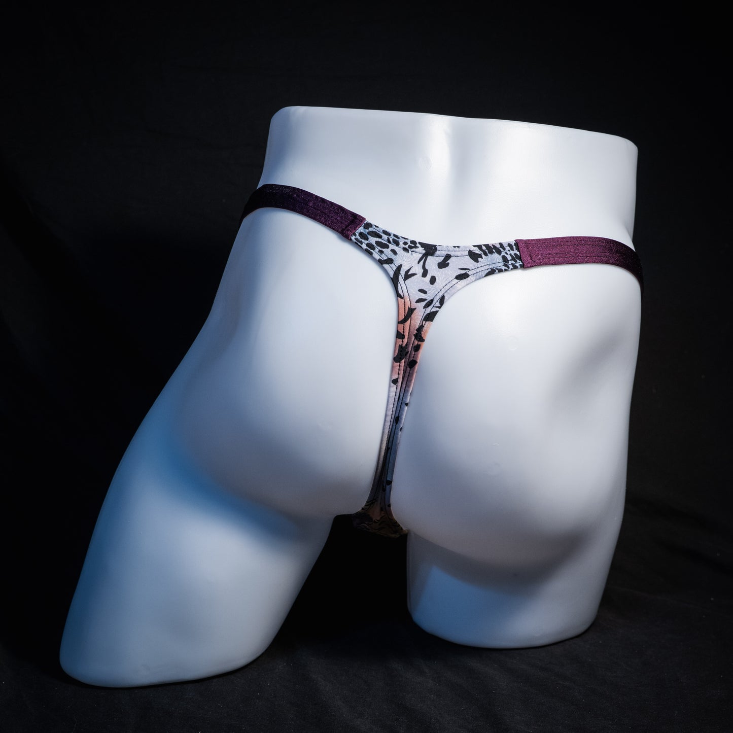 Men's purple wild cat thong underwear, classic cut, rear view.