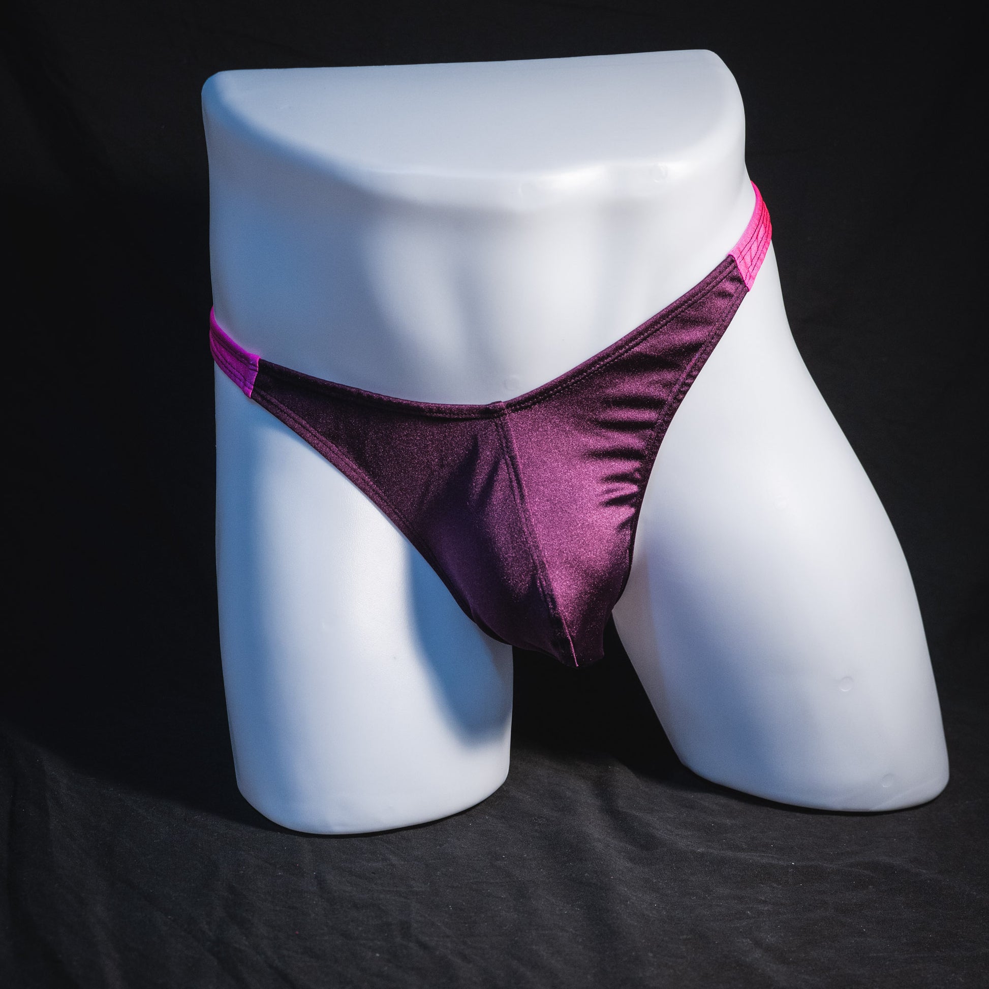 Men's purple and pink thong underwear, classic cut, full front view.
