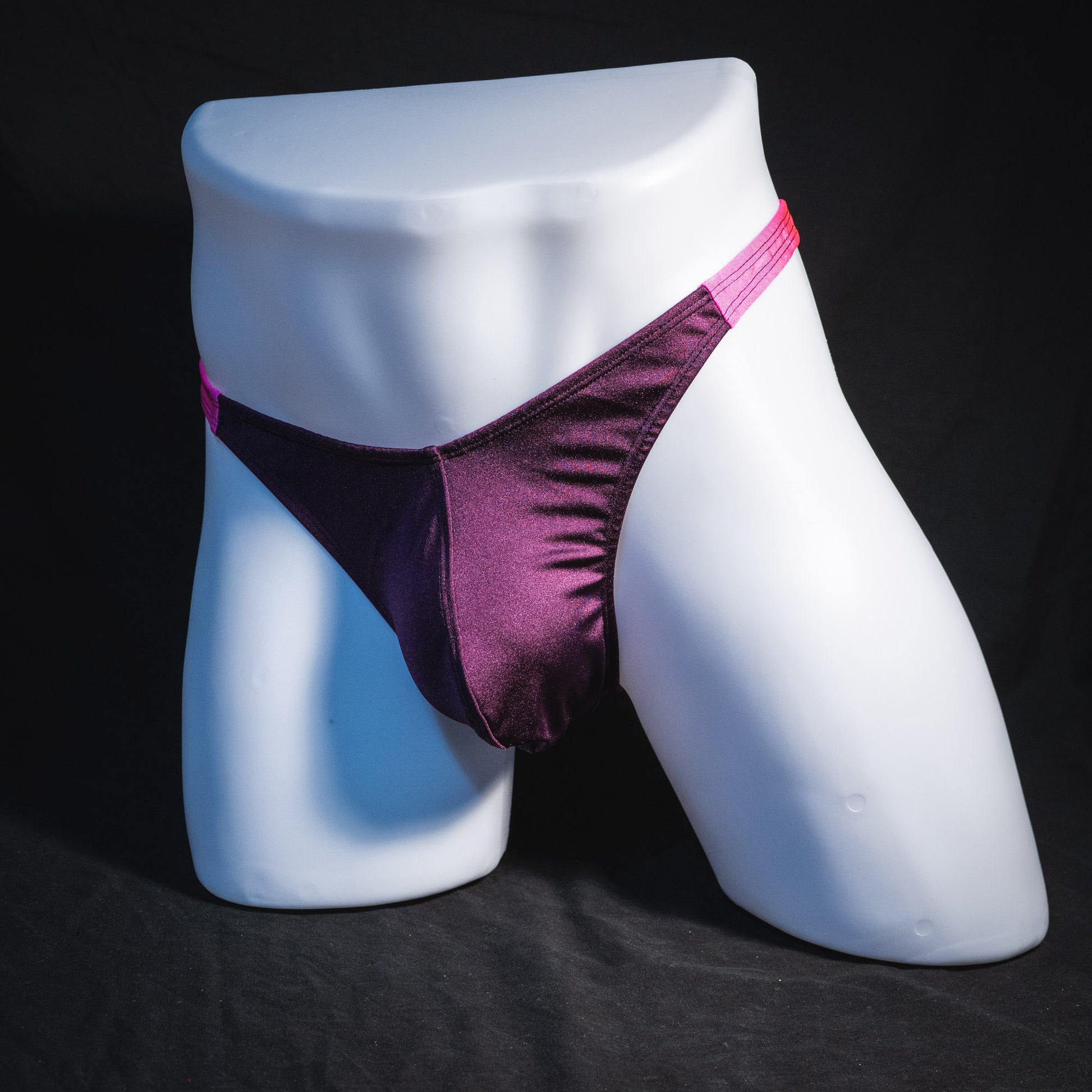 Men's purple and pink thong underwear, classic cut, full front angled view.
