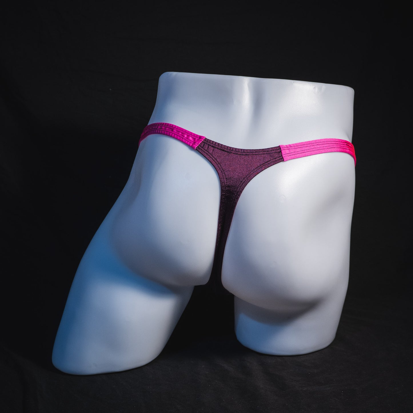Men's purple and pink thong underwear, classic cut, full rear view.