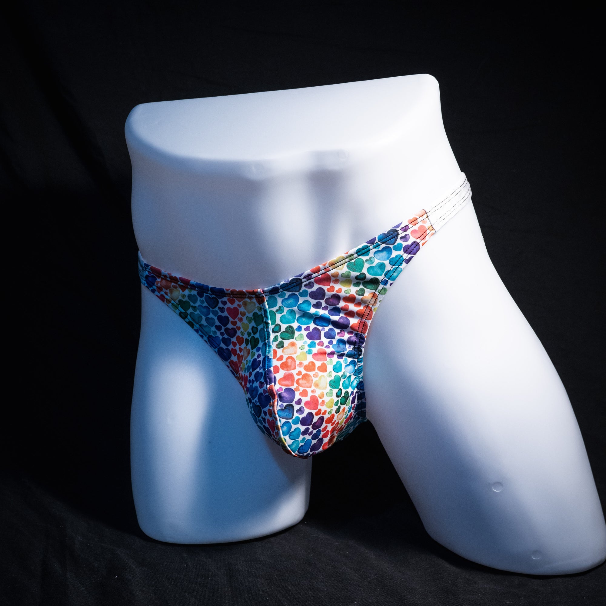 Men's rainbow hearts thong underwear, classic cut, Full angled front view
