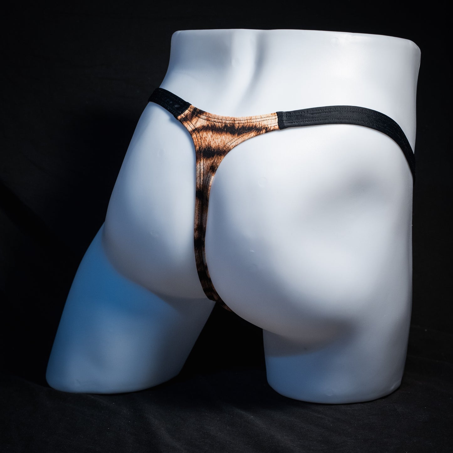 Men's tiger stripe thong underwear, classic cut, rear view.