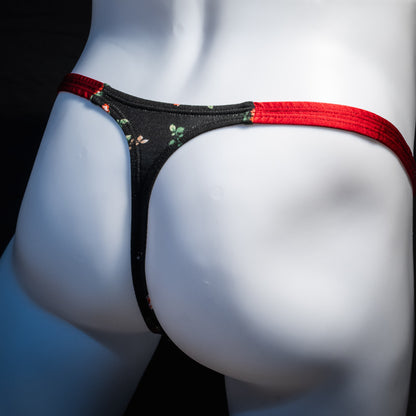 Men's red and black floral thong underwear, classic cut, rear view.