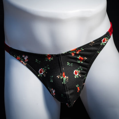 Men's red and black floral thong underwear, classic cut, front view.