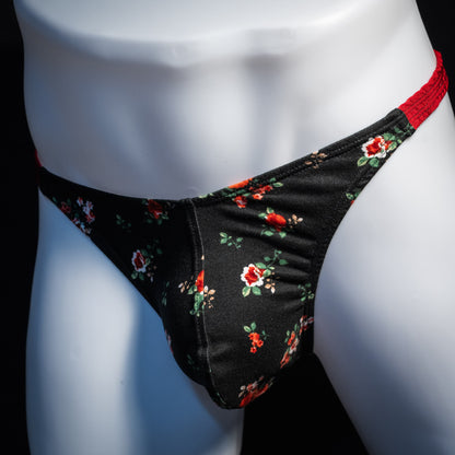 Men's red and black floral thong underwear, classic cut, front view.