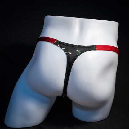 Men's red and black floral thong underwear, classic cut, rear view.