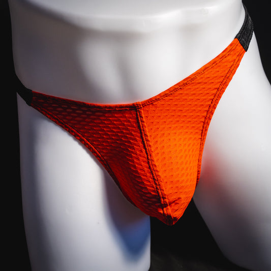 Men's red and black athletic mesh thong underwear, classic cut, front view.