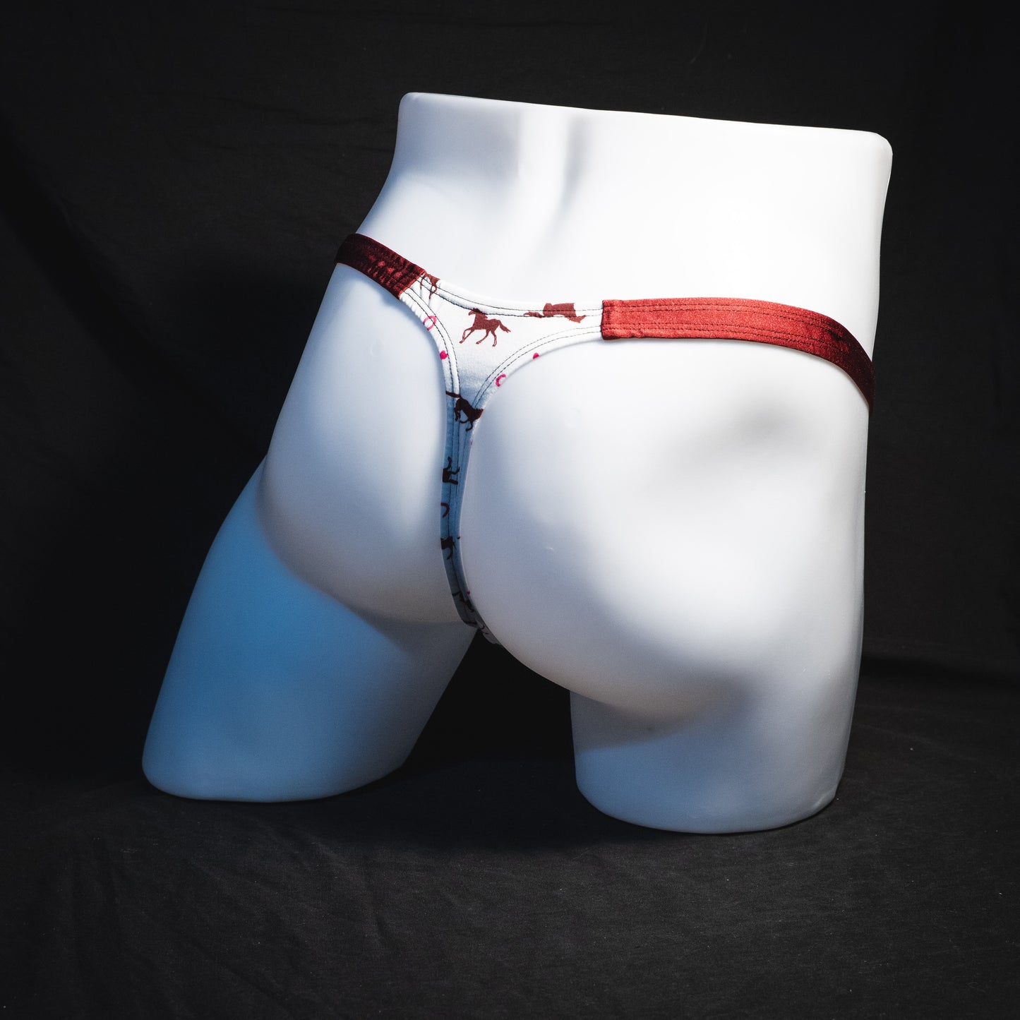 Men's red horses thong under, classic cut, Full rear angled view
