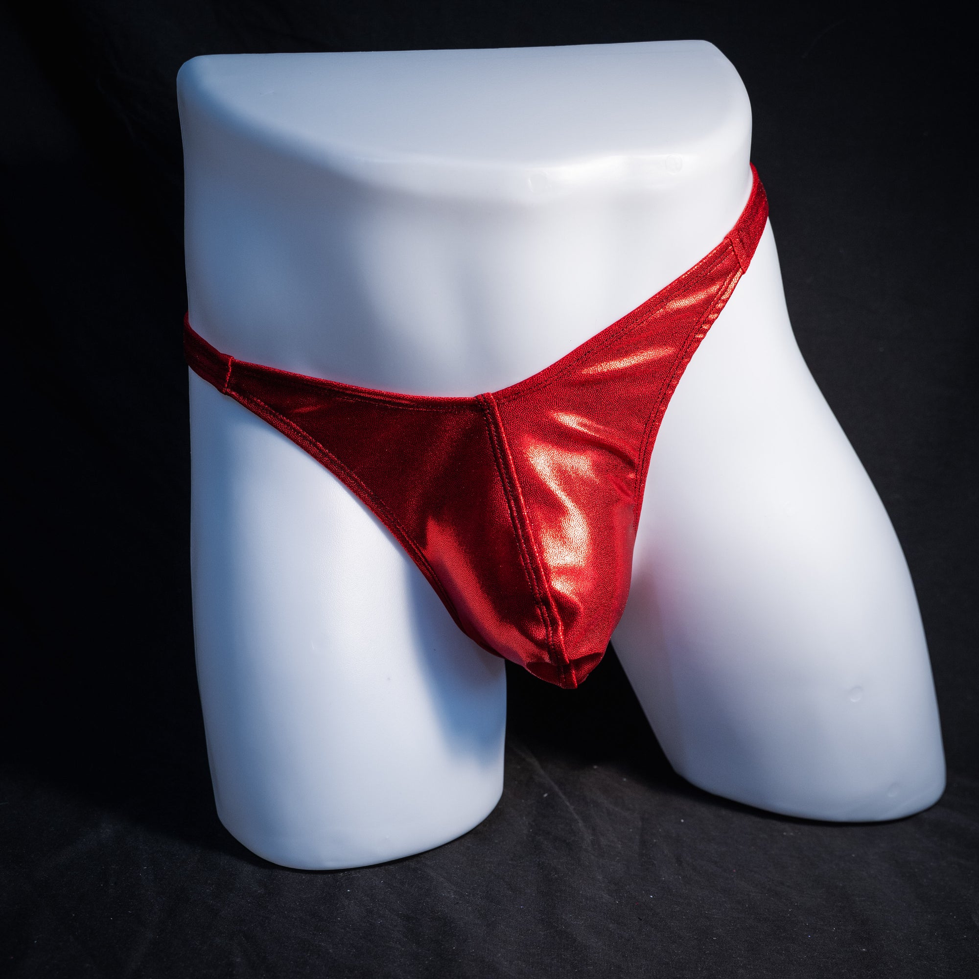 Men's red metallic thong underwear, classic cut, front view.