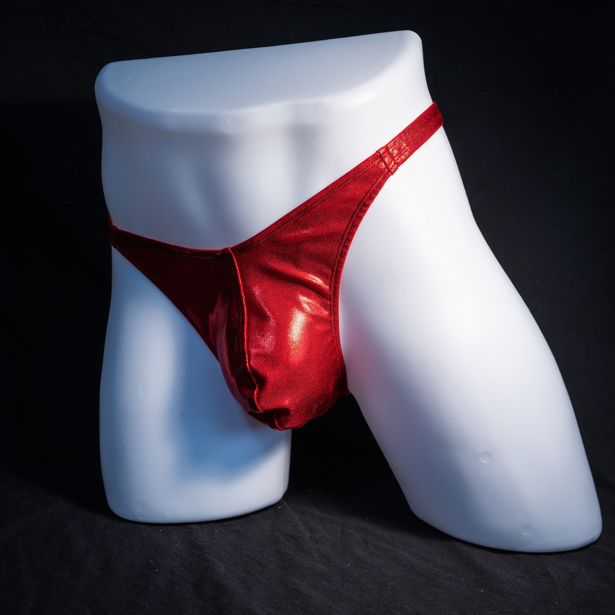 Men's red metallic thong underwear, classic cut, front view.