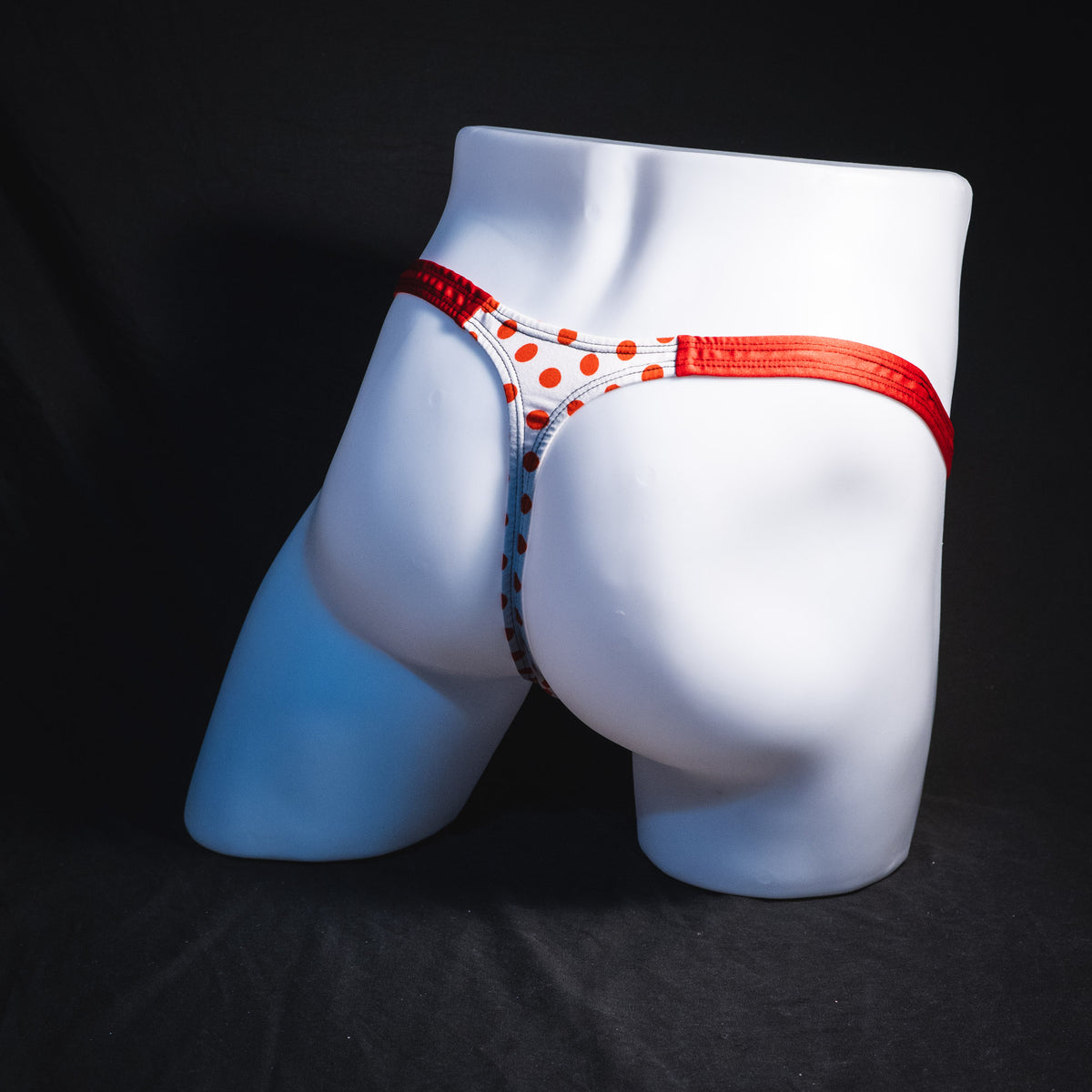 Men's red polka dot thong underwear, classic cut, Full angled rear view