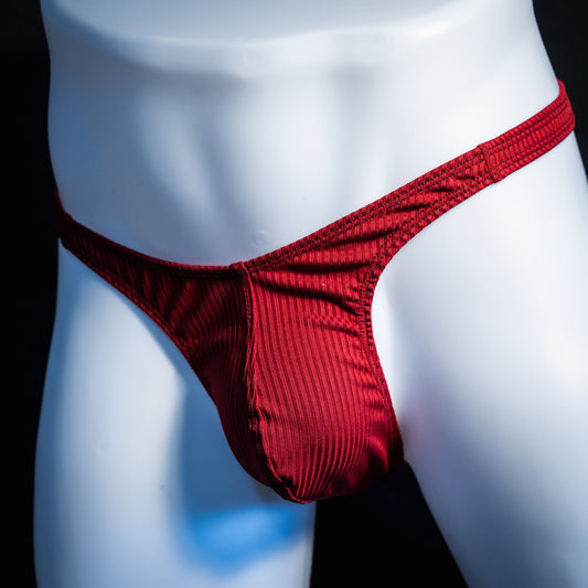 Men's ribbed red thong underwear, slim cut, front view.