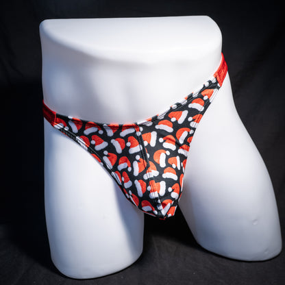 Men's red Santa hats, Christmas themed thong underwear, classic cut, front view.