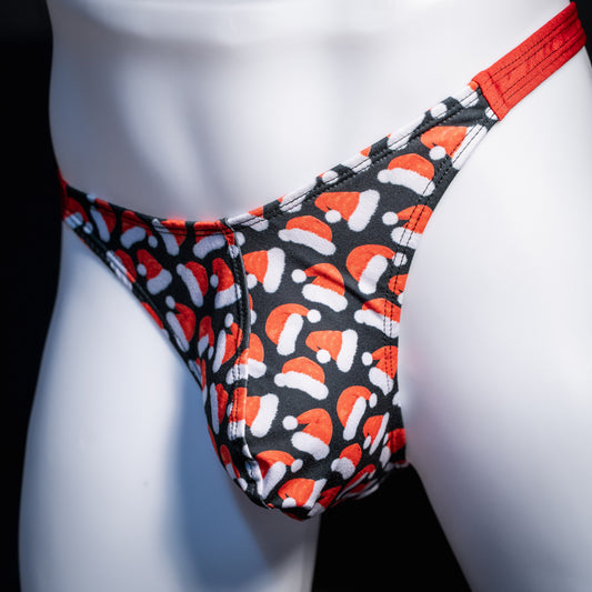 Men's red Santa hats, Christmas themed thong underwear, classic cut, front view.