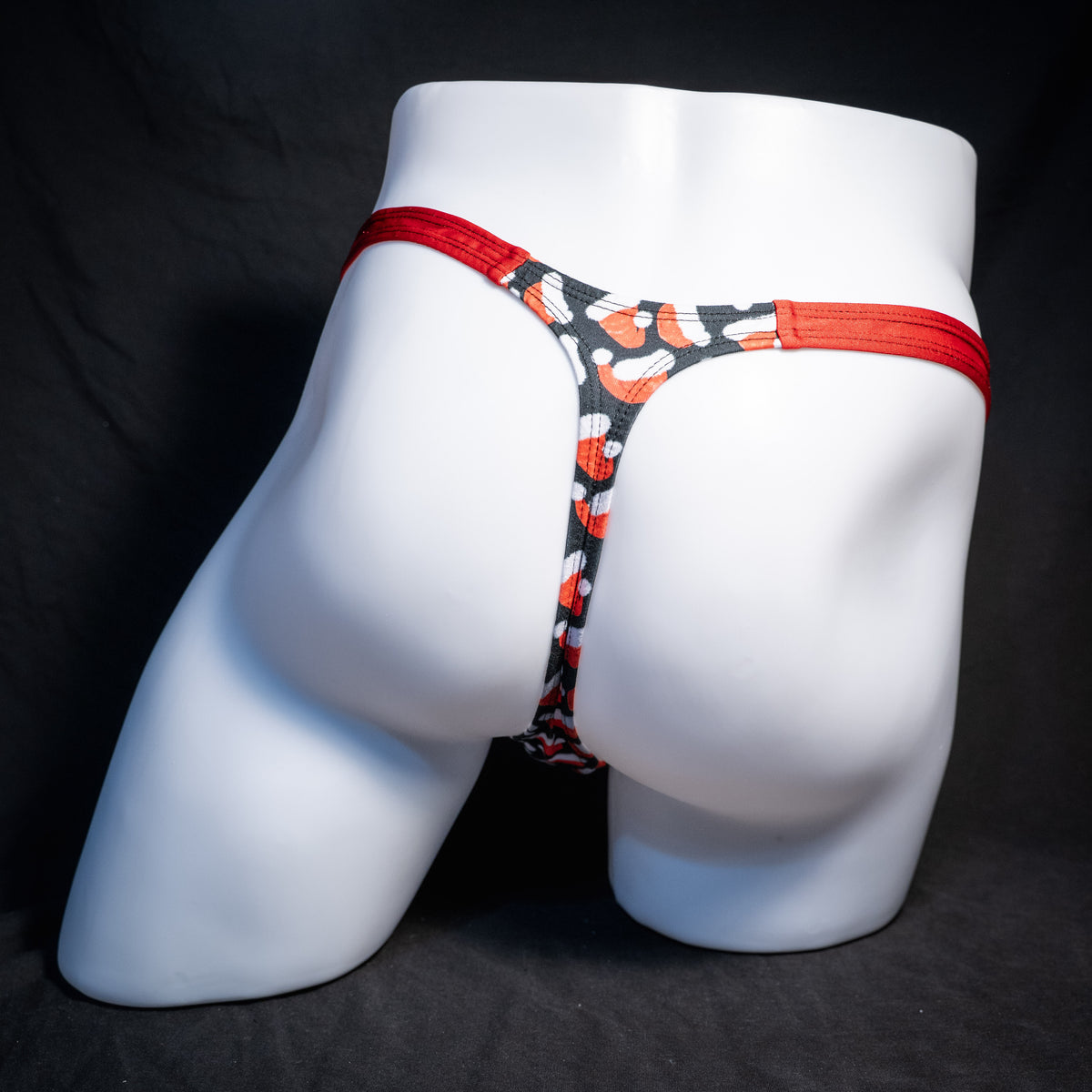 Men's red Santa hats, Christmas themed thong underwear, classic cut, rear view.