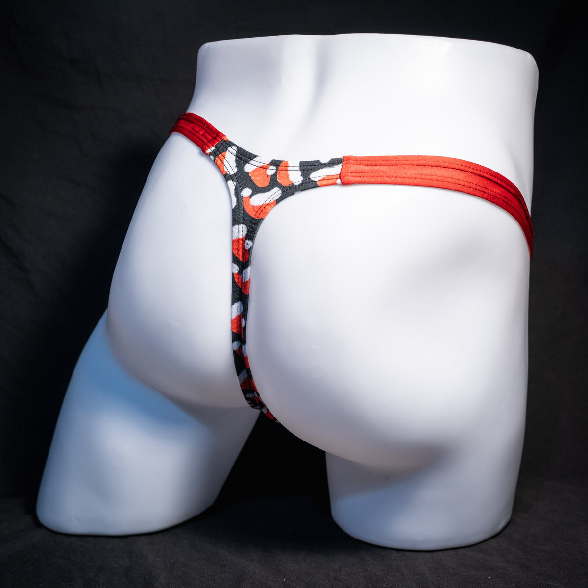 Men's red Santa hats, Christmas themed thong underwear, classic cut, rear view.