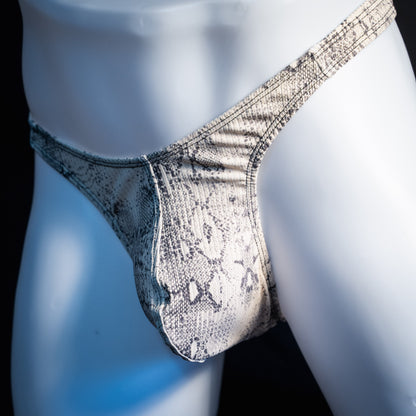 Men's beige snakeskin thong underwear, ribbed fabric, slim cut, front view.