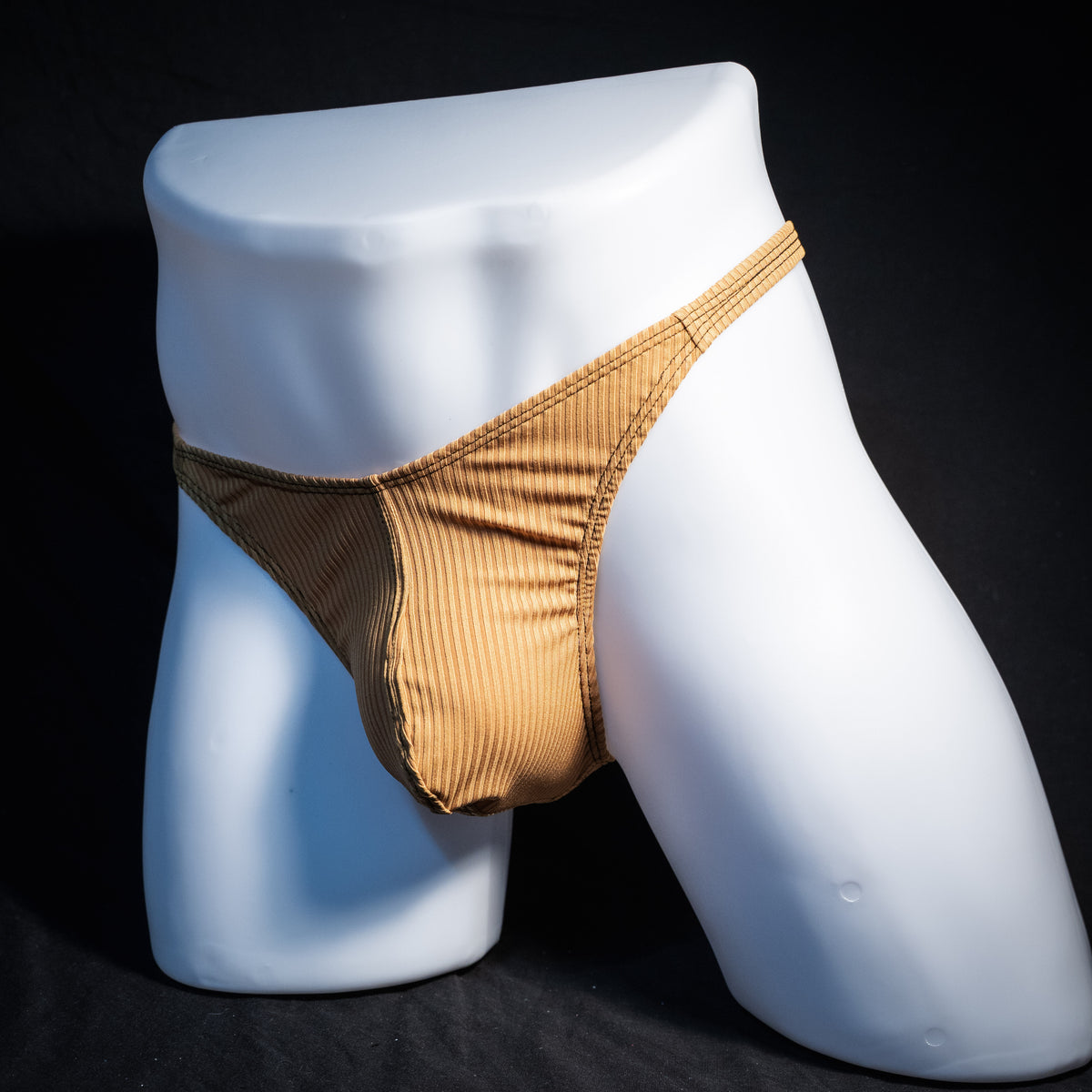 Men's ribbed gold thong underwear, classic cut, front view.
