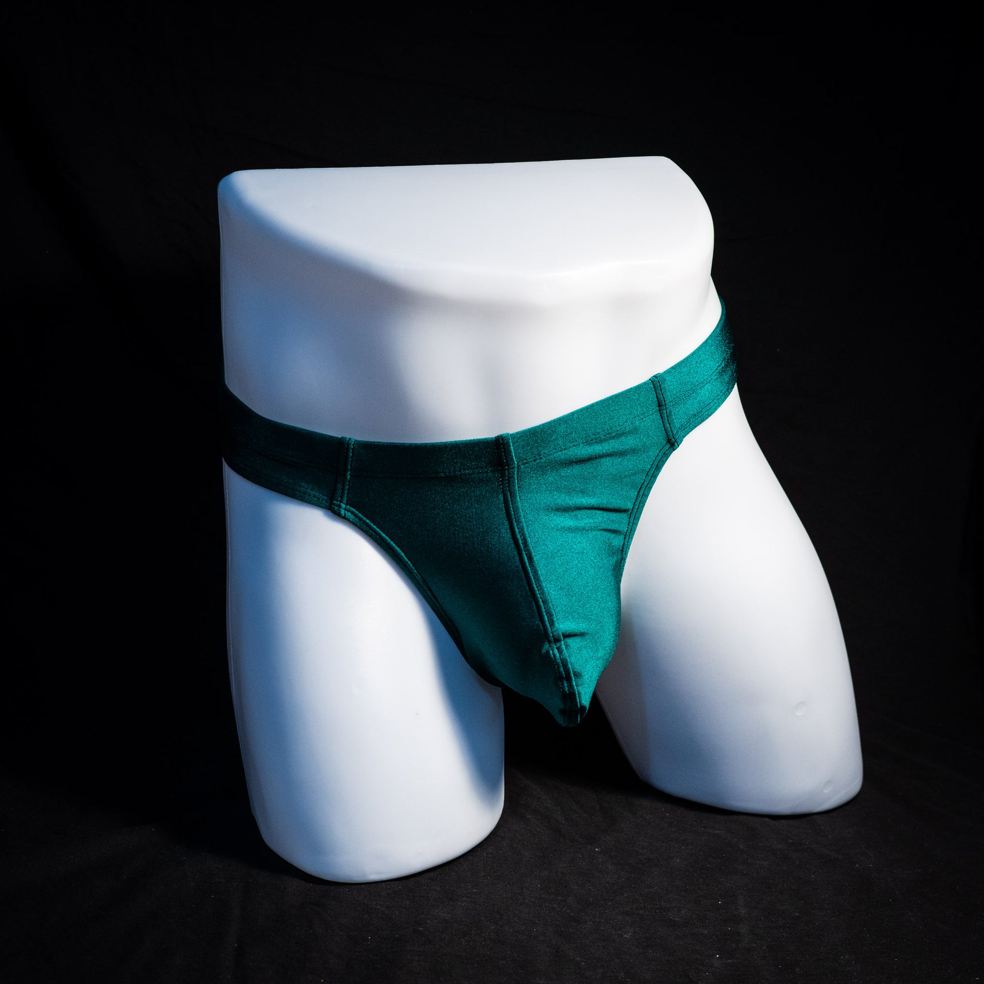 Men's forest green thong underwear, full front view.