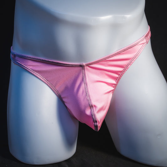 Men's rose pink thong underwear, classic cut, front view.