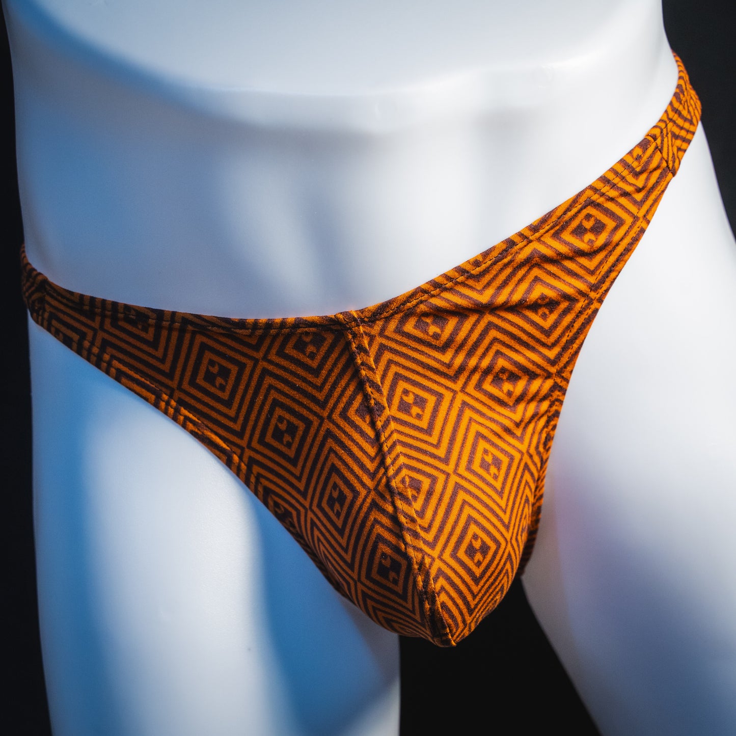Men's geometric rust thong underwear, classic cut, front view.