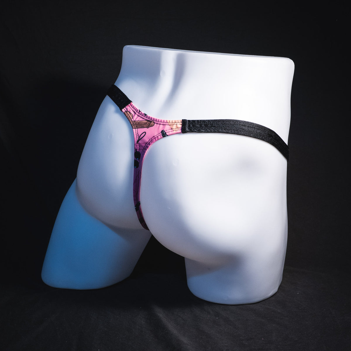 Men's sex toy print thong underwear, classic cut, Full rear angled view