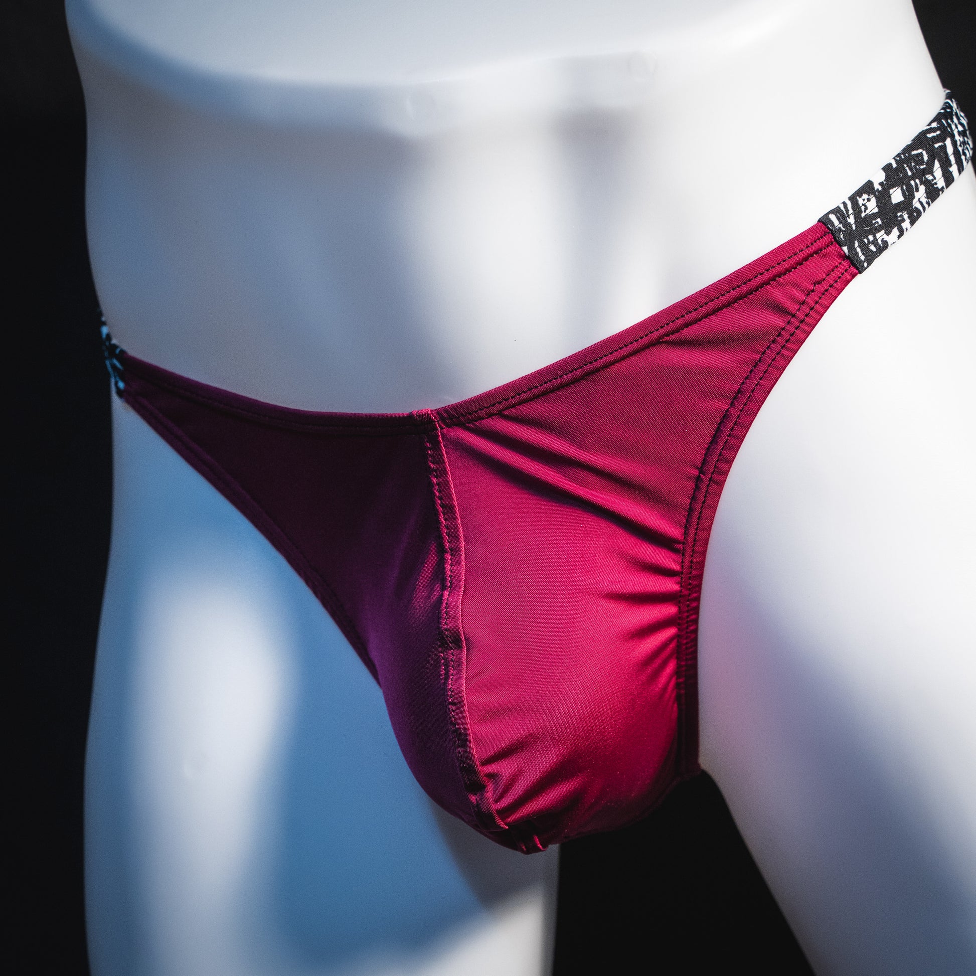 Men's silky maroon thong underwear, classic cut, Front angled view