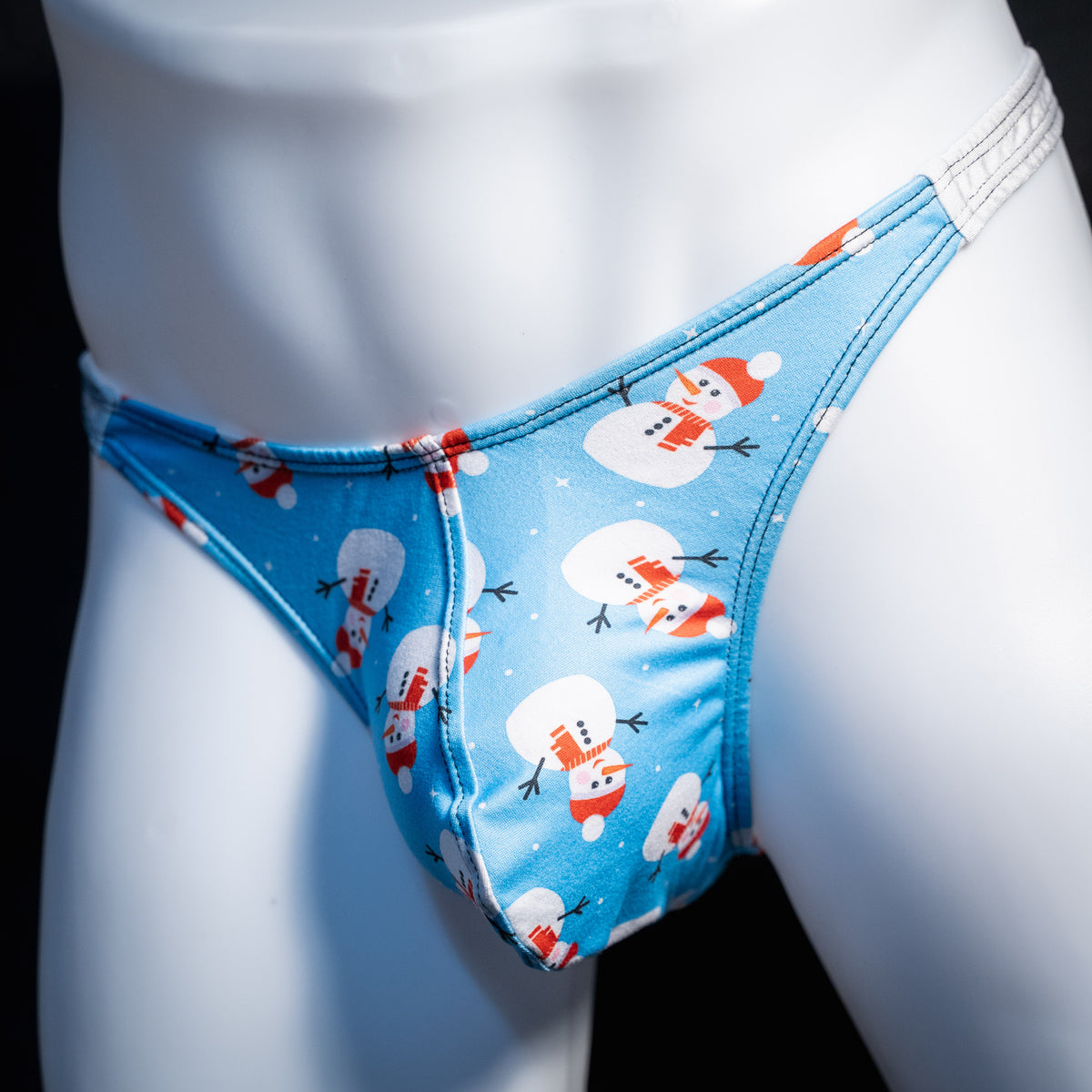 Men's Snowmen themed christmas thong underwear, classic cut, front view.