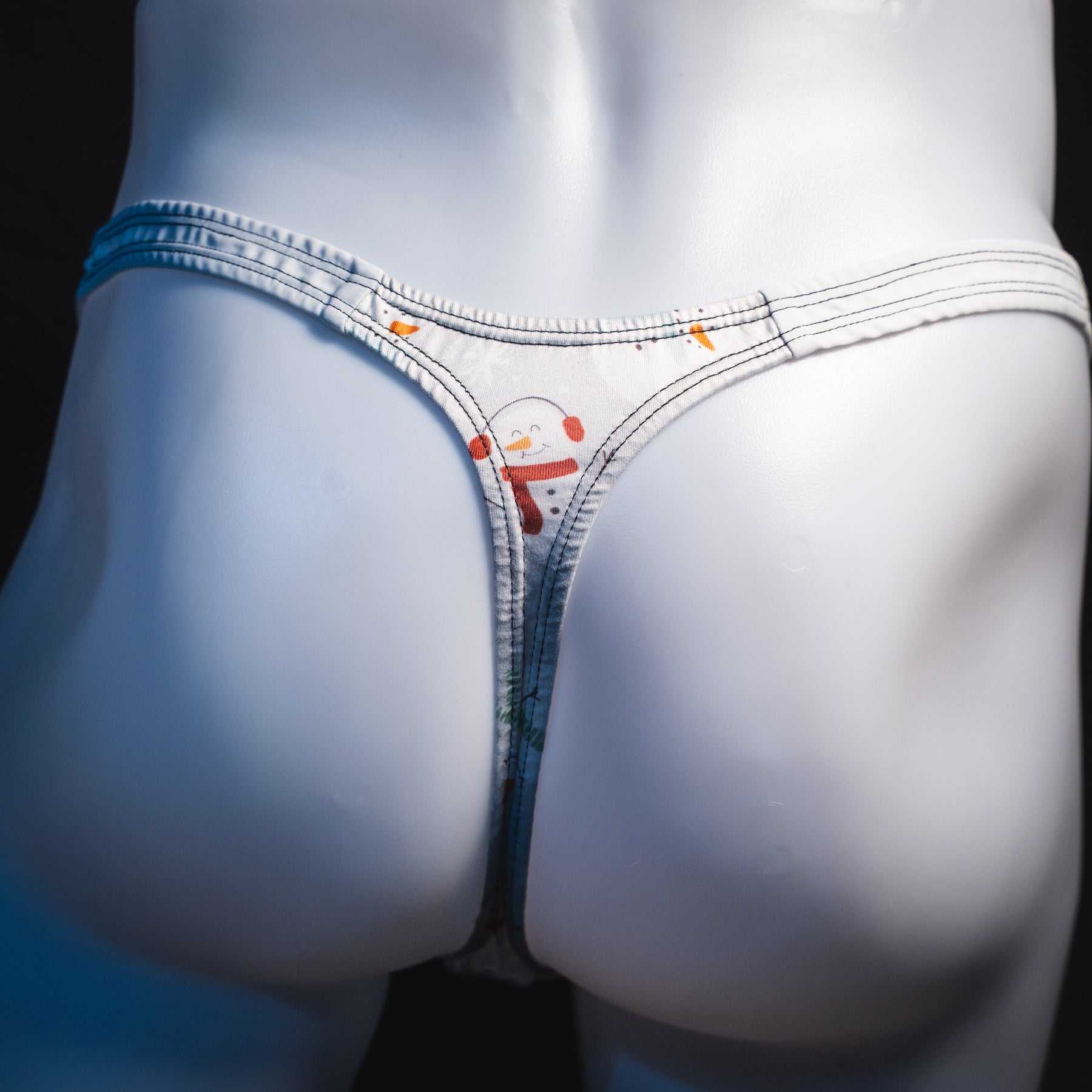 Men's snowmen thong underwear, classic cut, rear view.