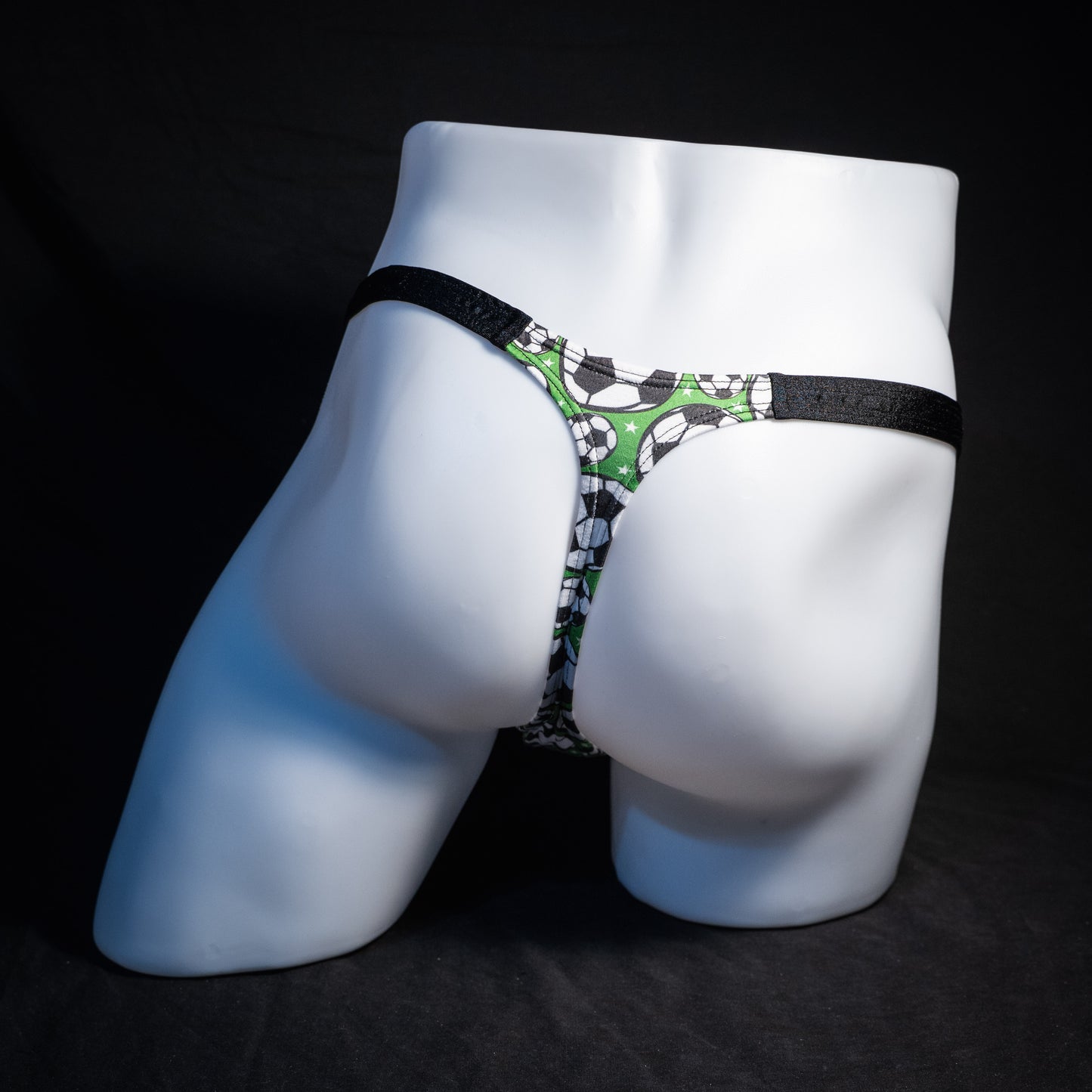 Men's soccer themed thong underwear, classic cut, rear view.