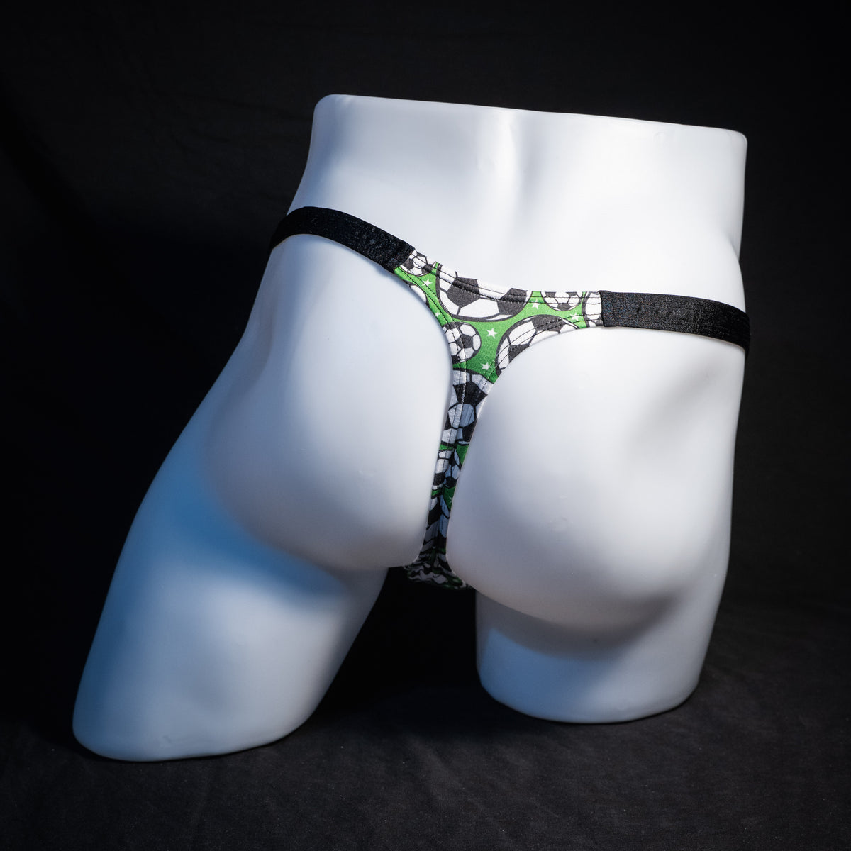 Men's soccer themed thong underwear, classic cut, rear view.