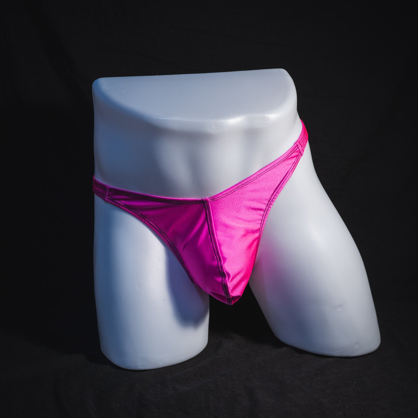 Men's solid pink thong underwear, classic cut, full front view.