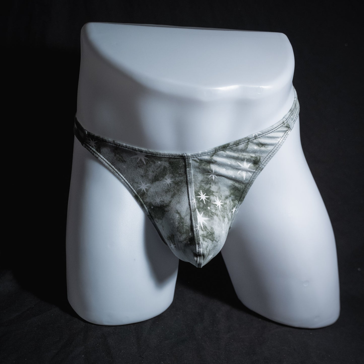 Men's grey tie dye with stars thong underwear, classic cut, full front view.