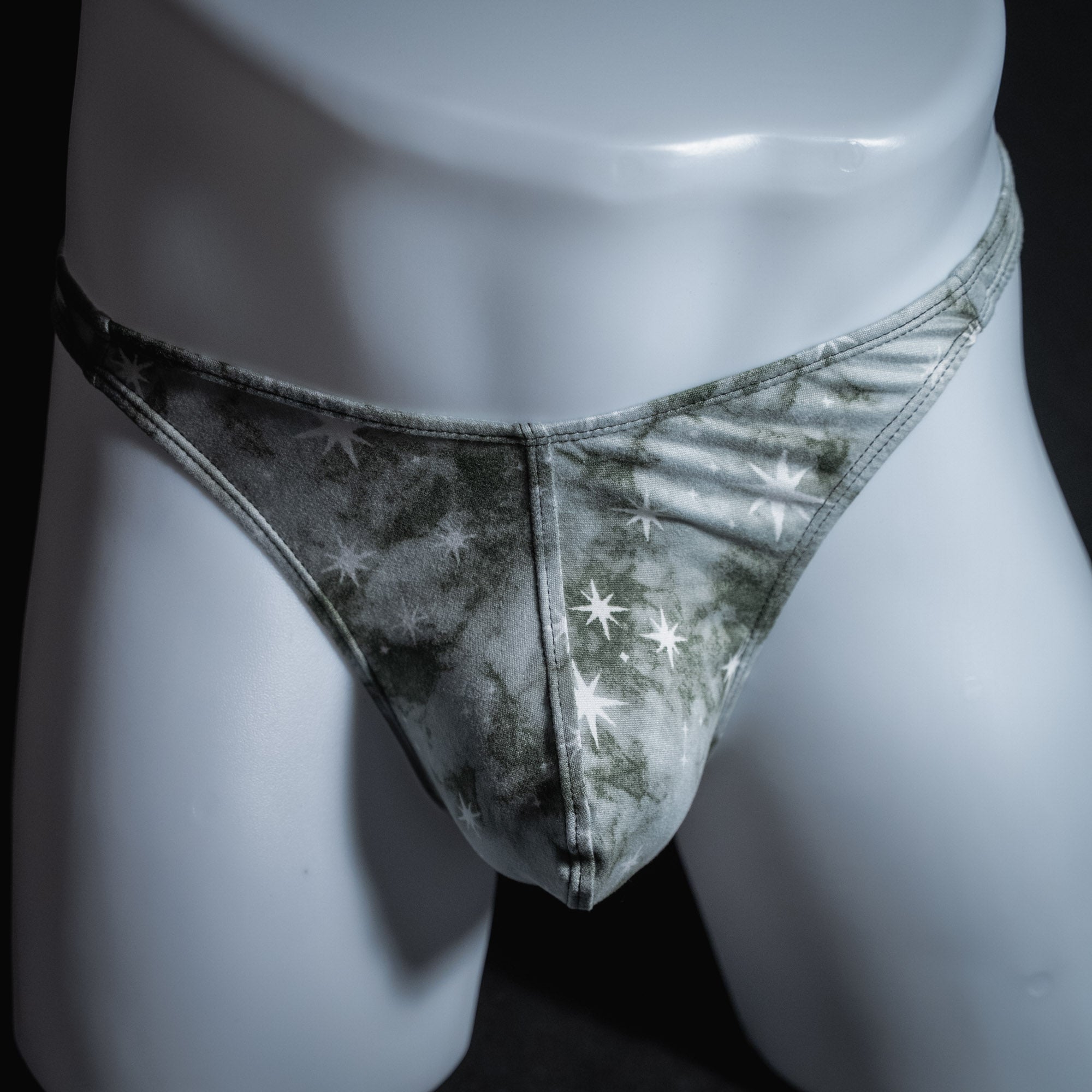 Men's grey tie dye with stars thong underwear, classic cut, front view.