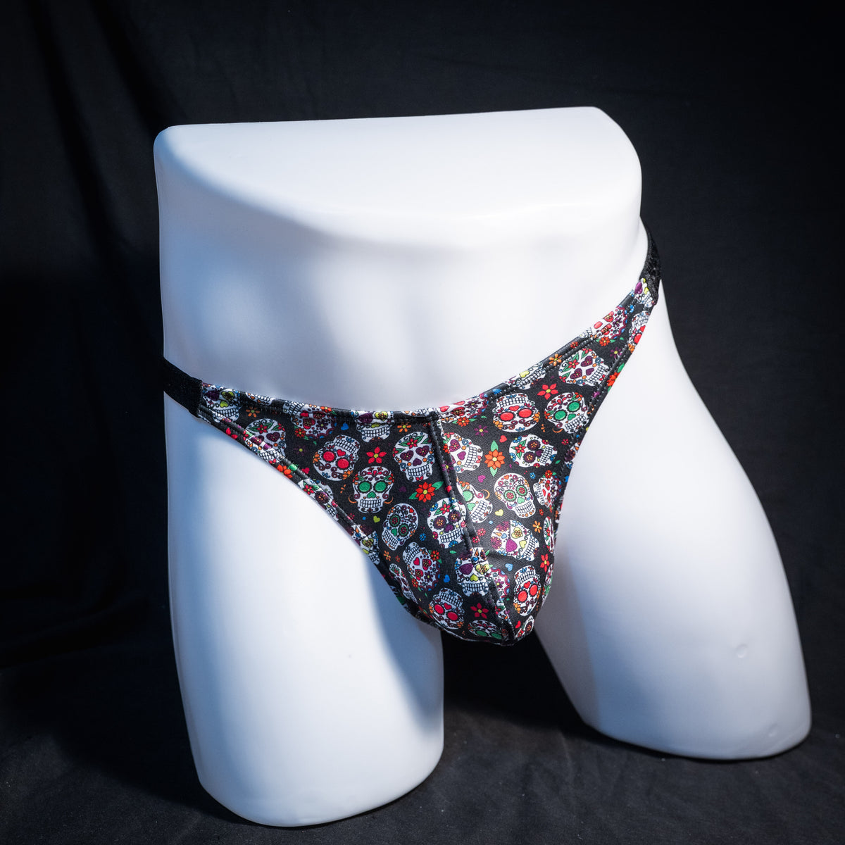 Men's sugar skull patterned thong underwear, classic cut, front view.