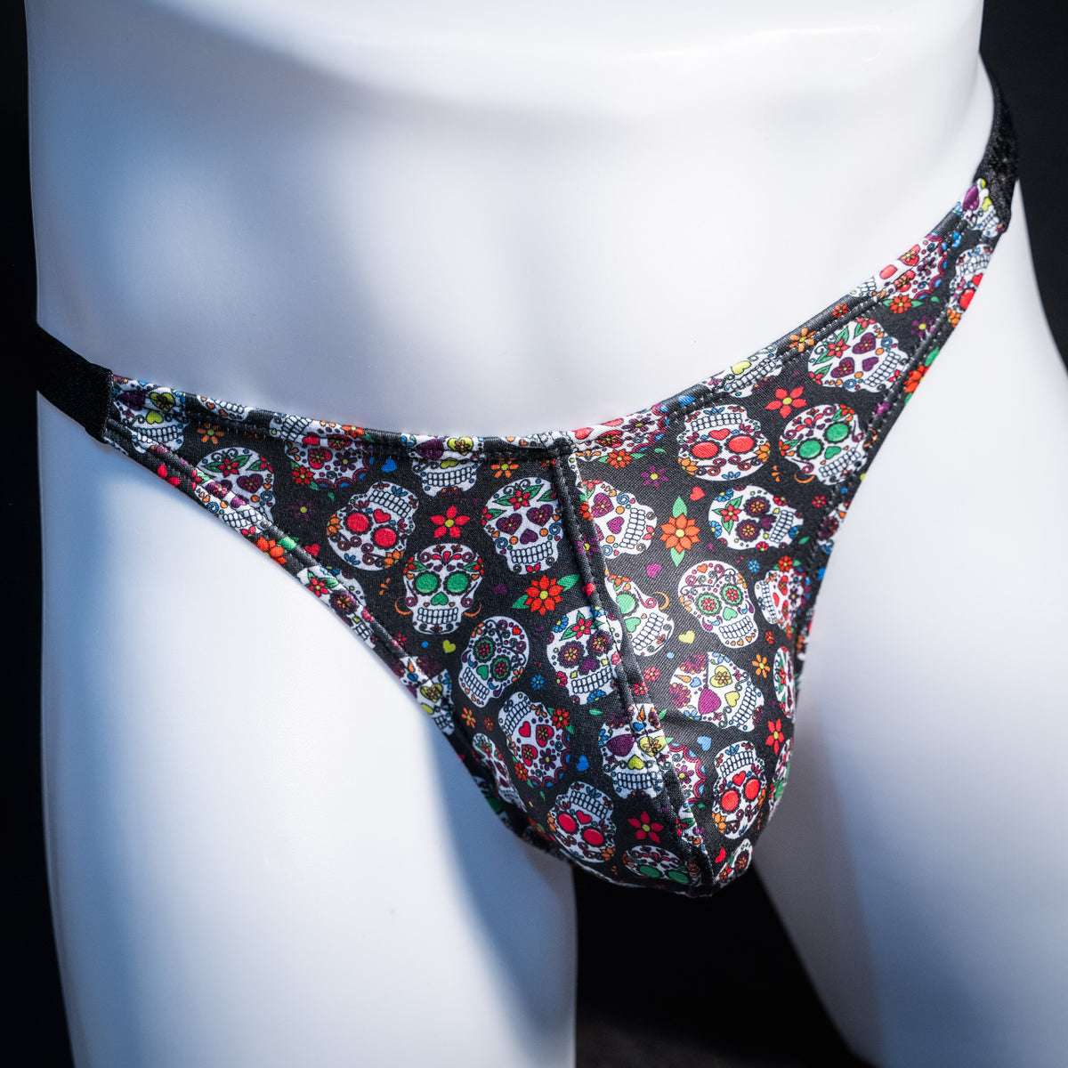 Men's sugar skull patterned thong underwear, classic cut, front view.