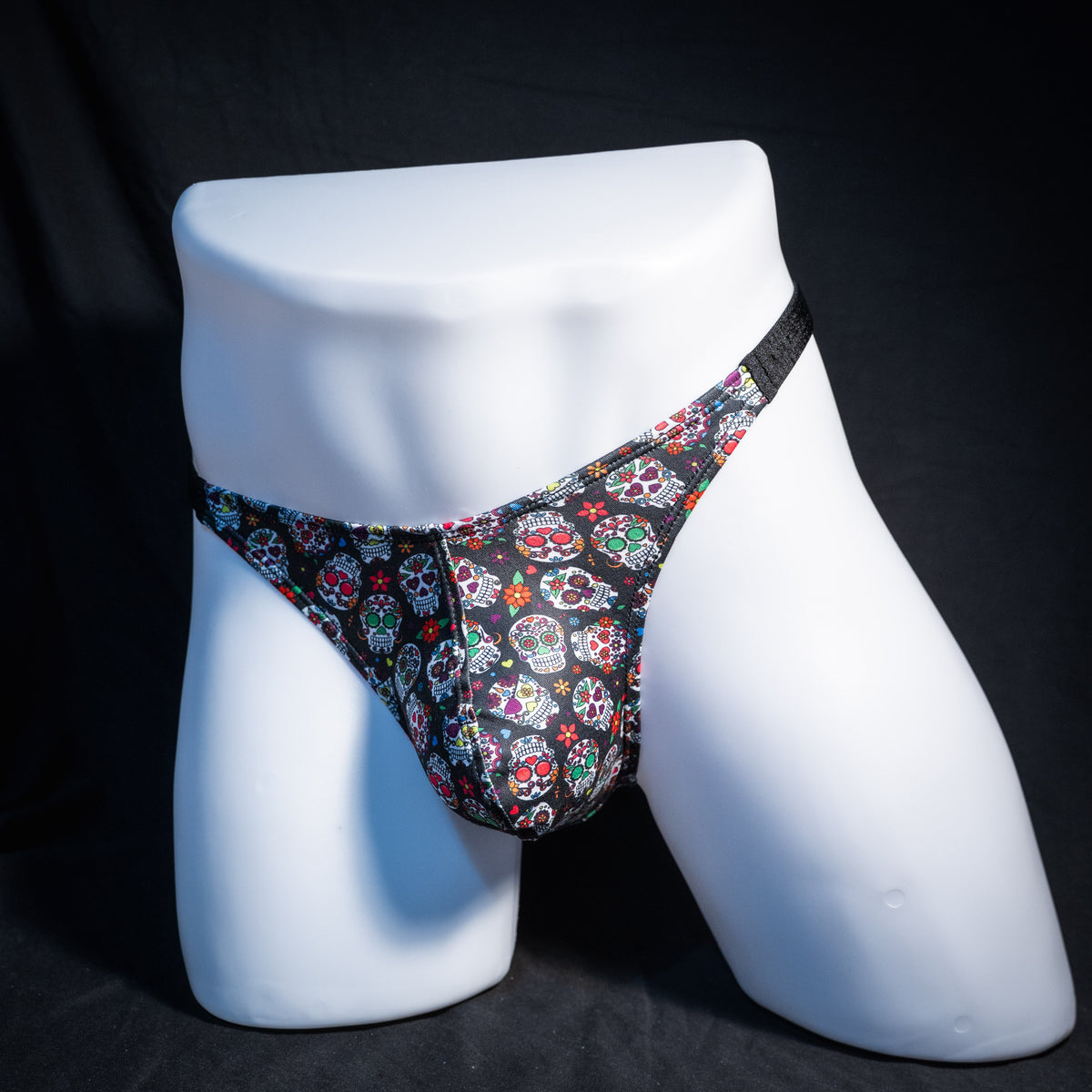 Men's sugar skull patterned thong underwear, classic cut, front view.