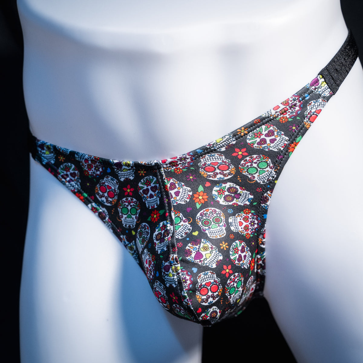 Men's sugar skull patterned thong underwear, classic cut, front view.
