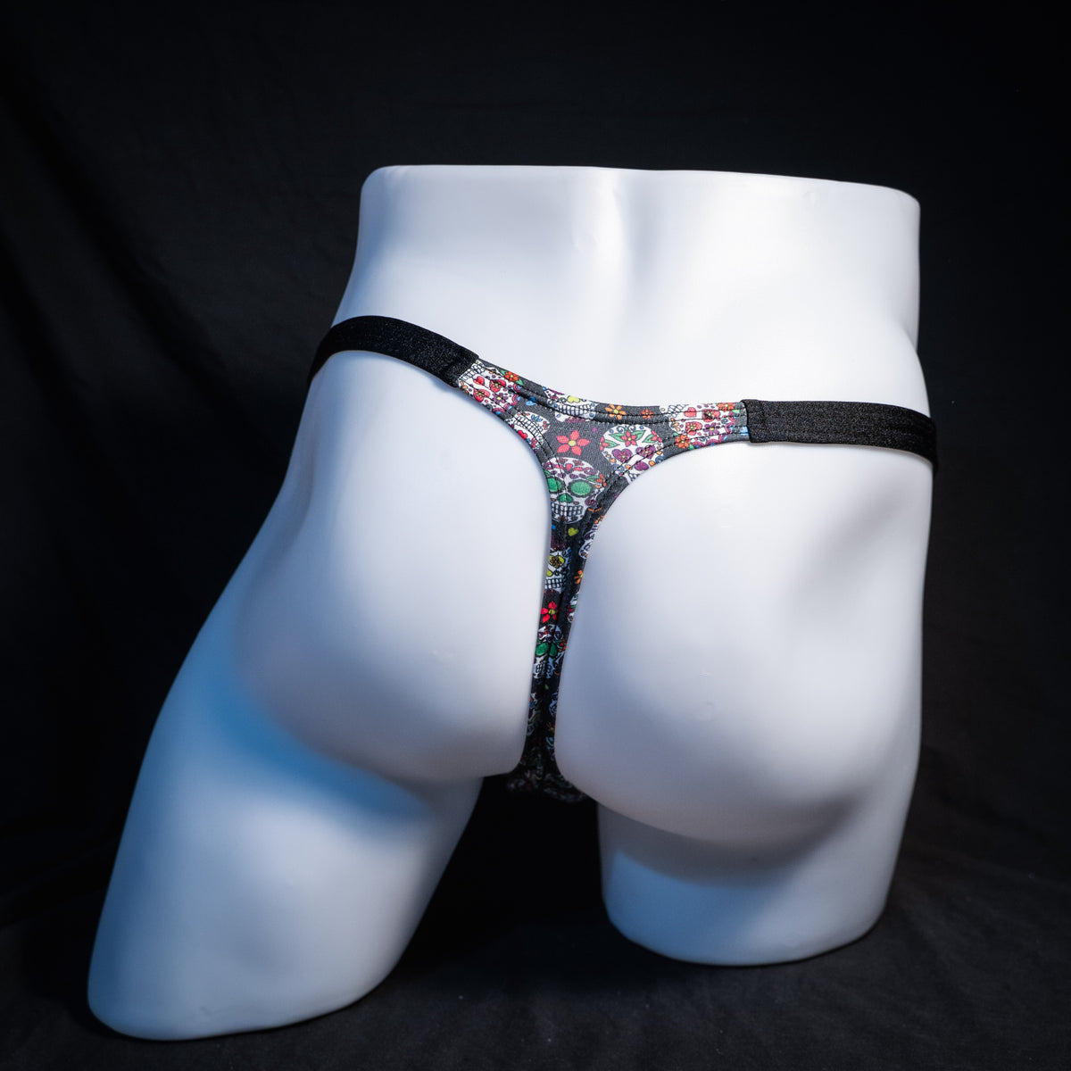 Men's sugar skull patterned thong underwear, classic cut, rear view.