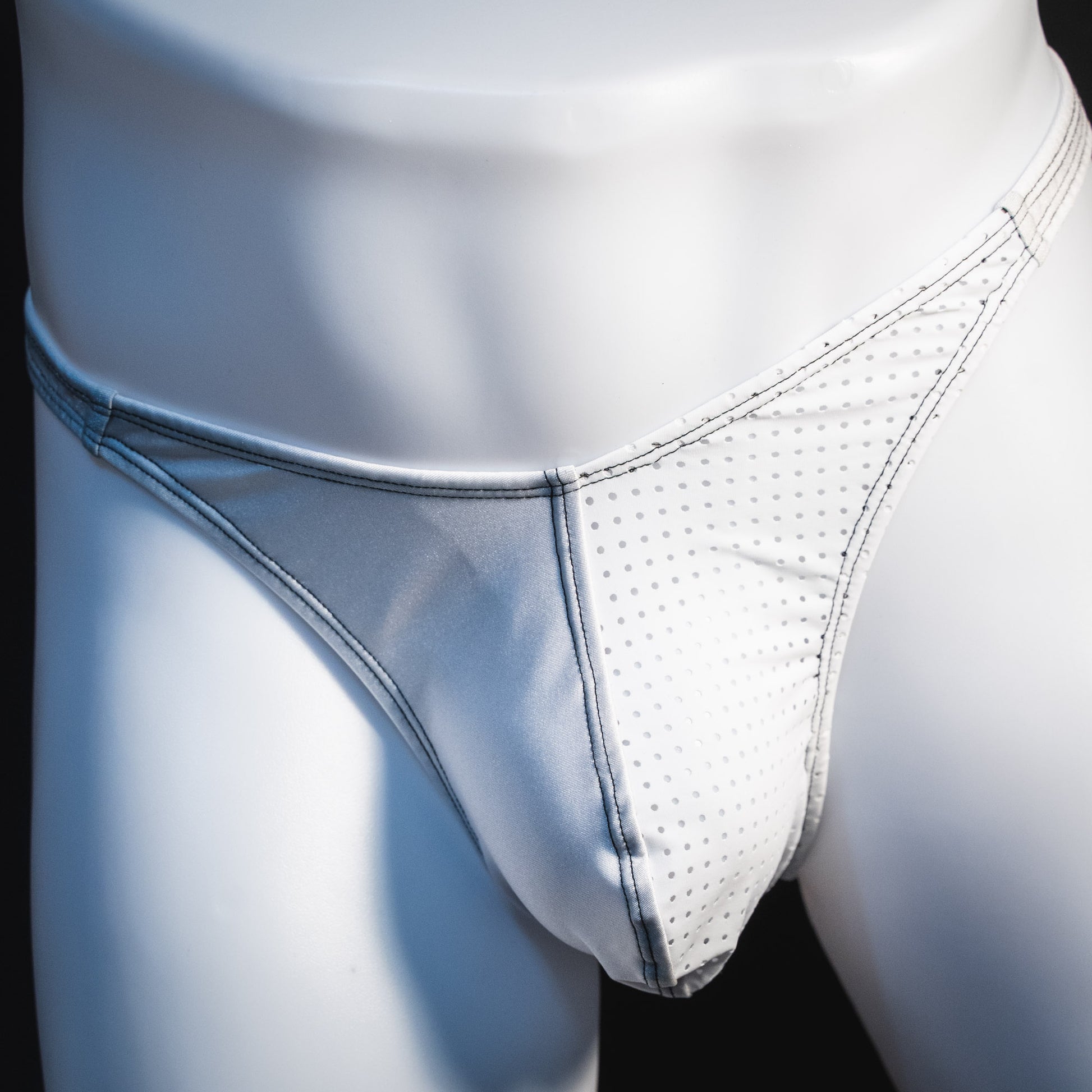 Men's white mesh thong underwear, classic cut, front view.