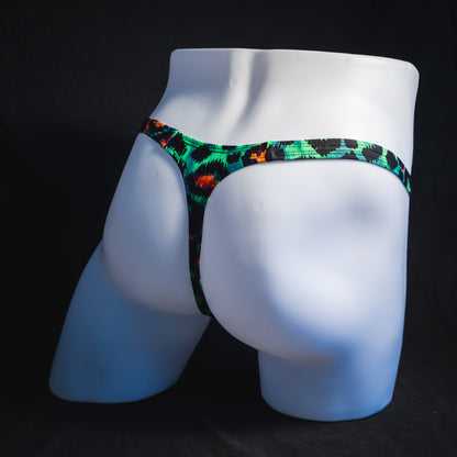 Men's wild green cheetah thong underwear, tower cut, full angled rear view.
