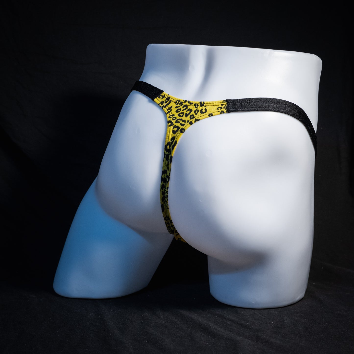 Men's yellow cheetah thong underwear, classic cut, rear view.
