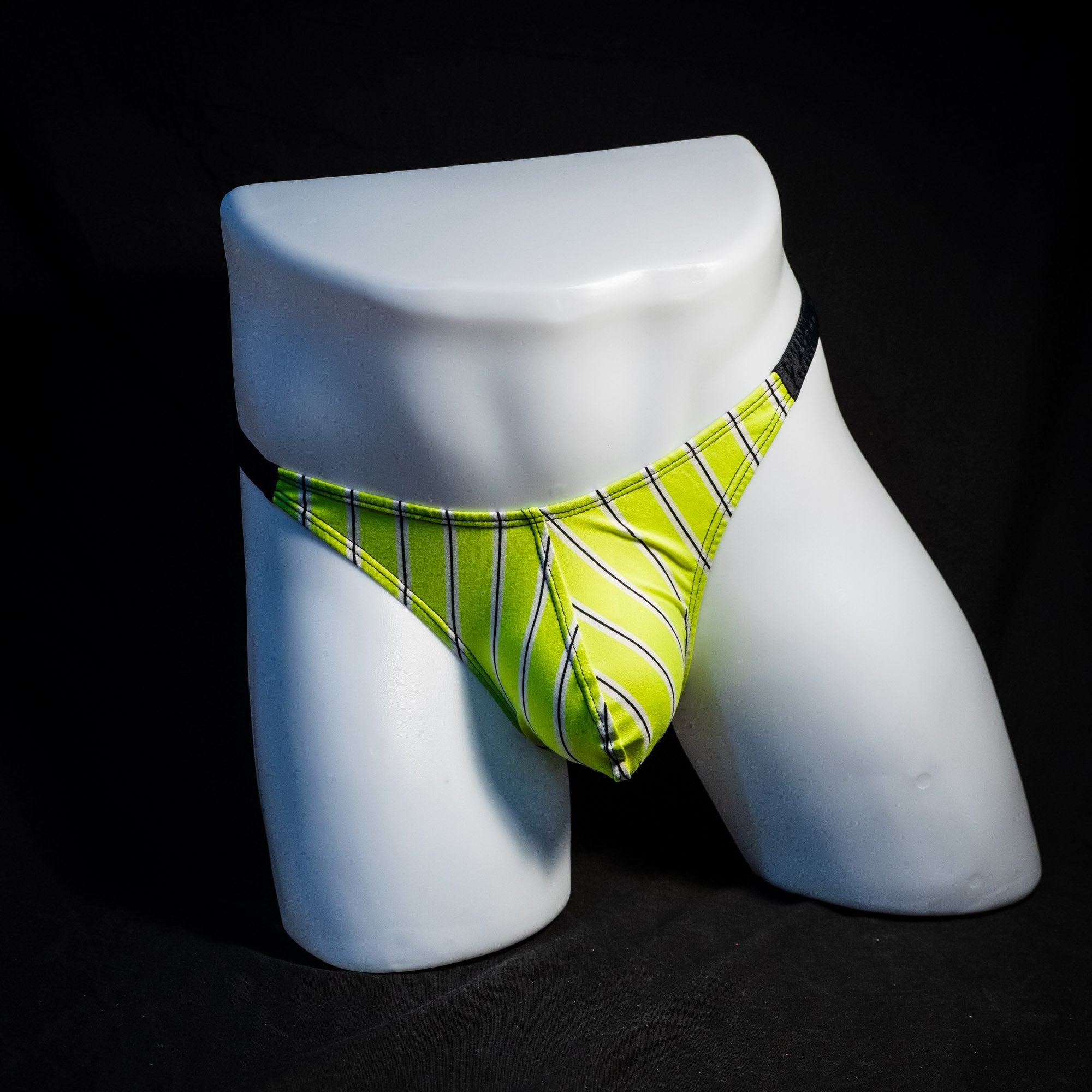 Men's yellow striped thong underwear, classic cut, full front view.
