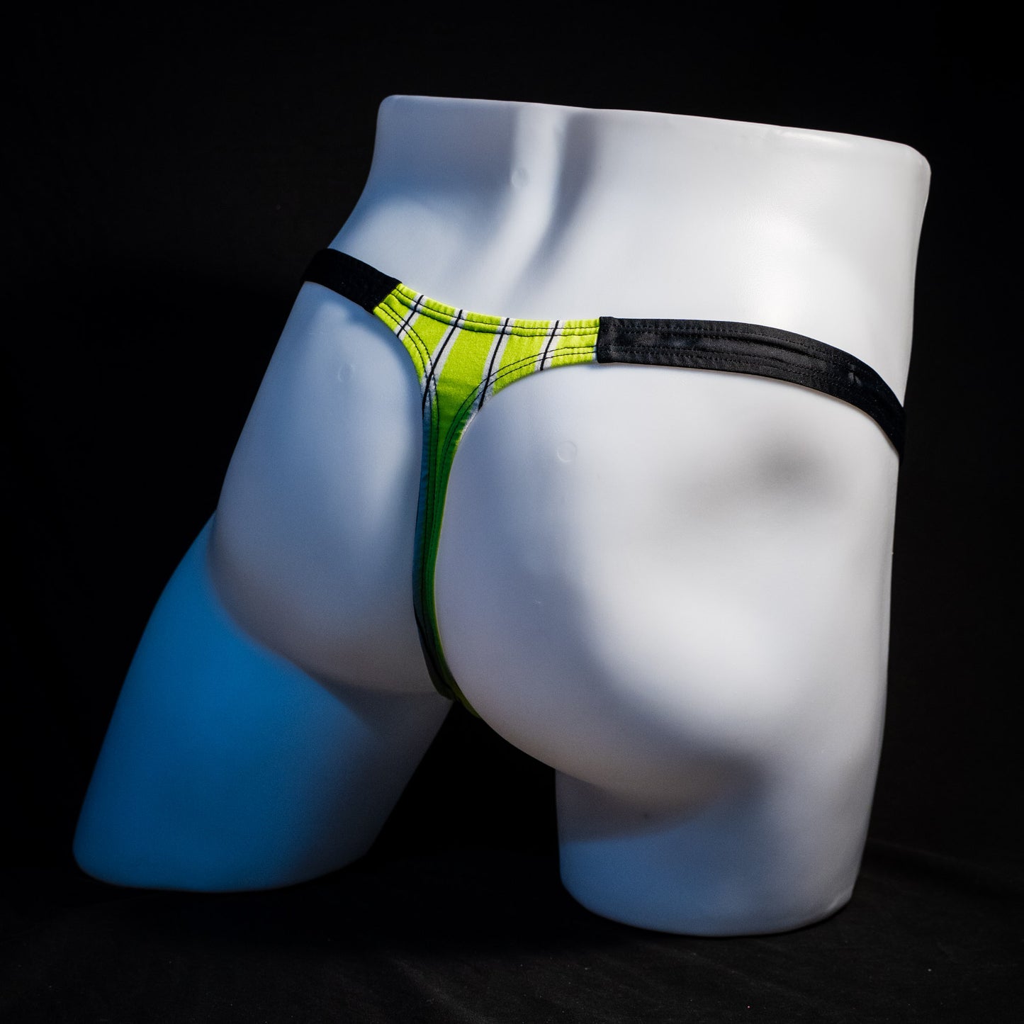 Men's yellow striped thong underwear, classic cut, full rear angled view.