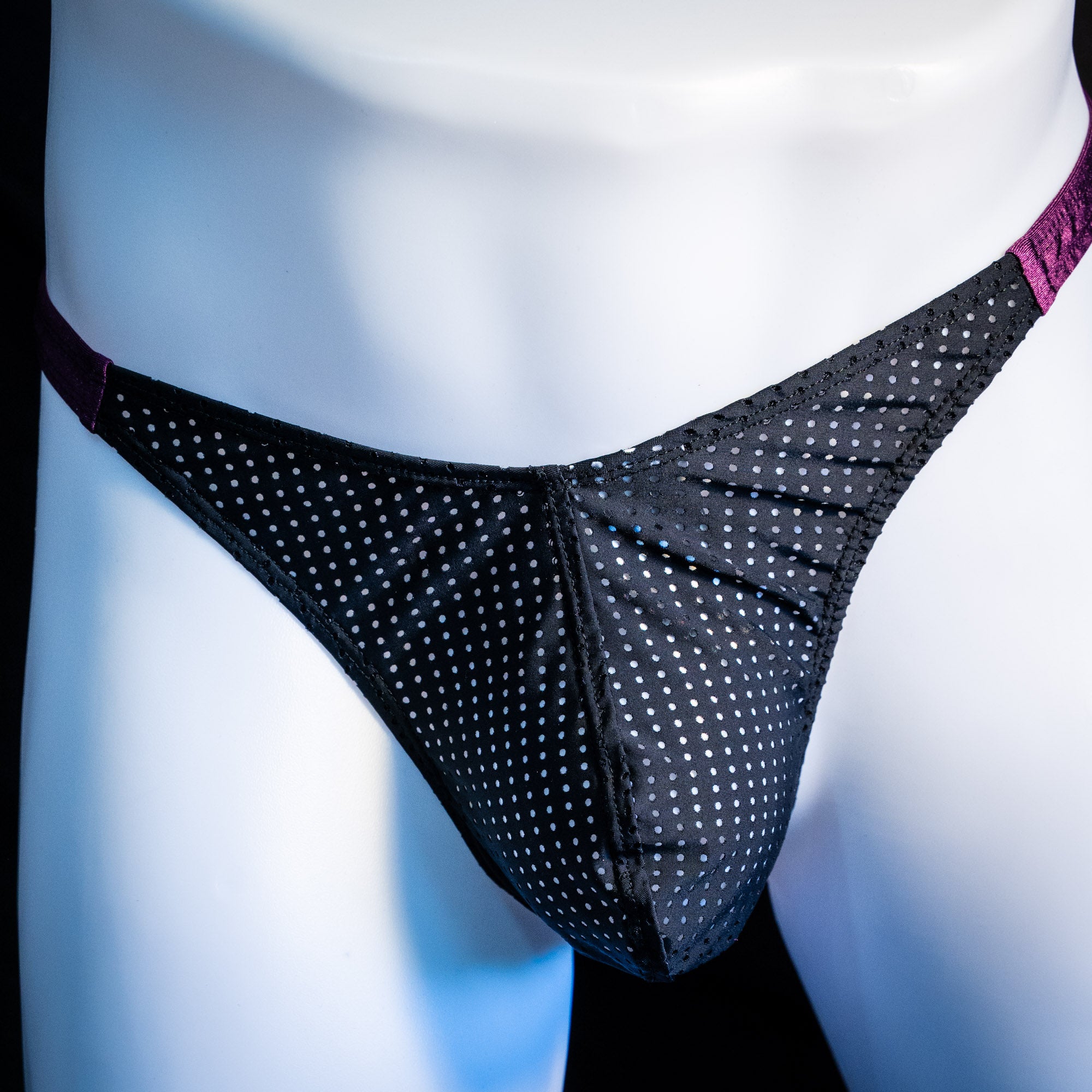 Men's mesh and plum purple thong underwear, classic cut, front view.
